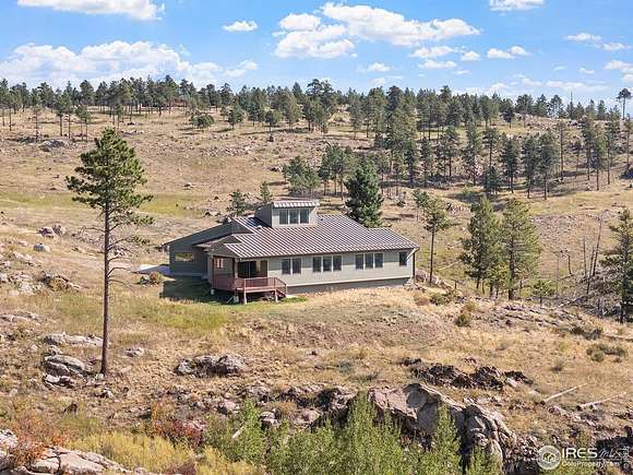 19.99 Acres of Land with Home for Sale in Bellvue, Colorado