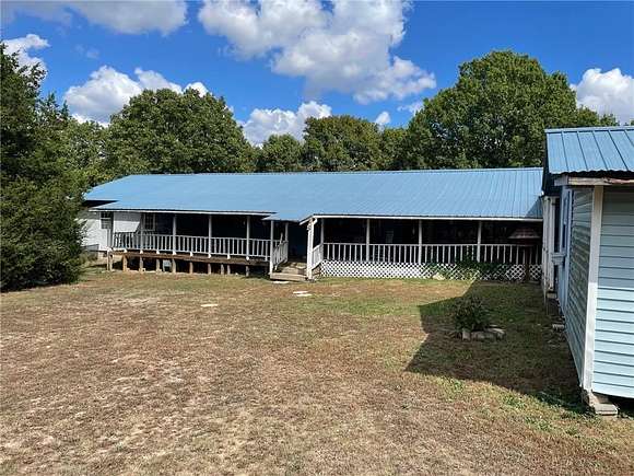 5.13 Acres of Residential Land with Home for Sale in Berryville, Arkansas