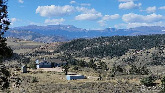 35.41 Acres of Agricultural Land with Home for Sale in Livermore, Colorado