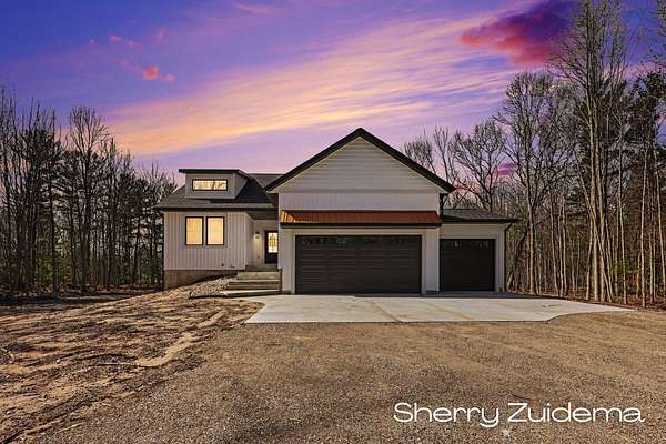 6.8 Acres of Land with Home for Sale in Spring Lake, Michigan