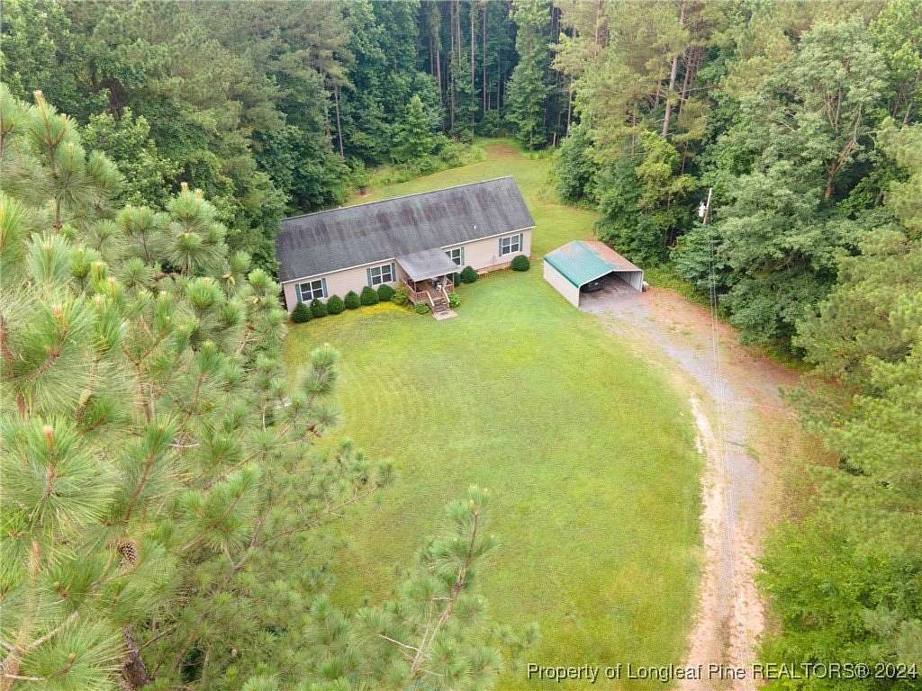 14.3 Acres of Recreational Land with Home for Sale in Sanford, North Carolina