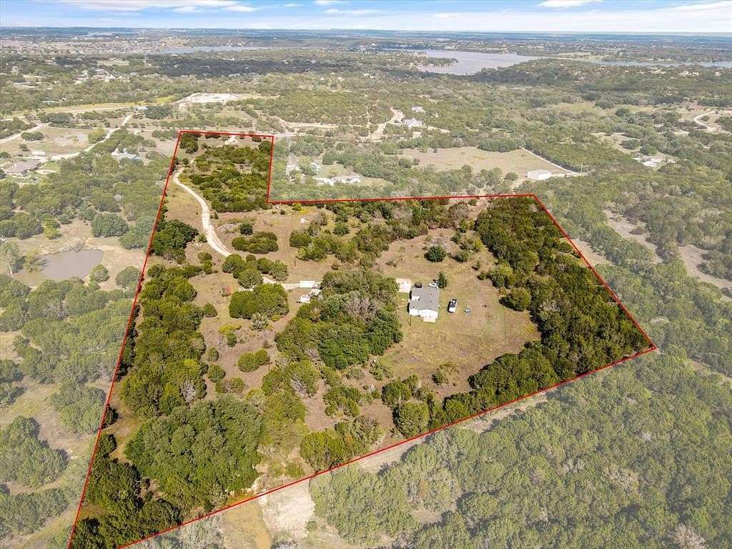 23.03 Acres of Land with Home for Sale in Granbury, Texas