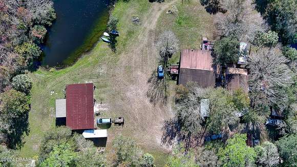 2.68 Acres of Residential Land with Home for Sale in Edgewater, Florida