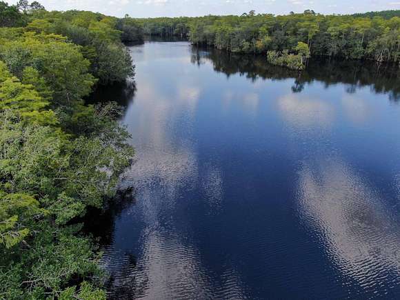 6.76 Acres of Residential Land with Home for Sale in Ebro, Florida