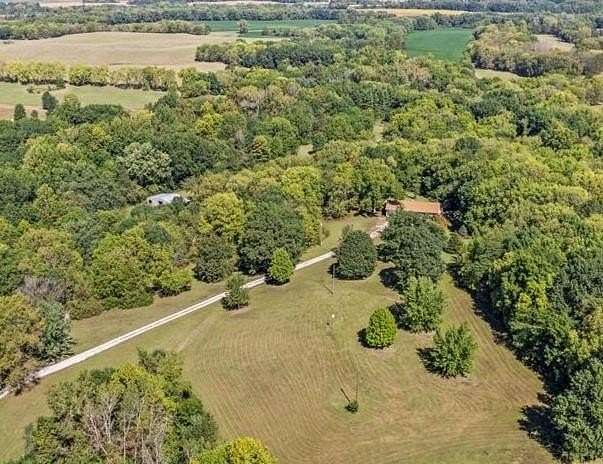 32.69 Acres of Land with Home for Auction in Liberty, Missouri