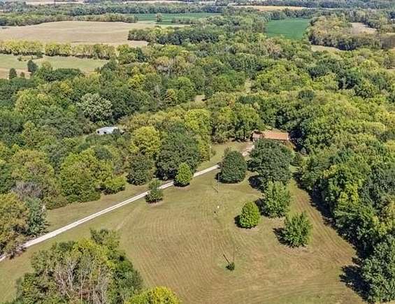 32.69 Acres of Land with Home for Auction in Liberty, Missouri