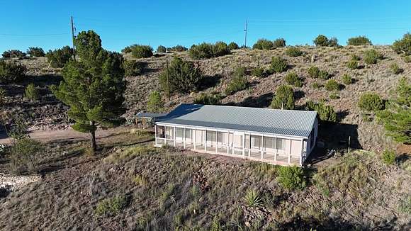 12.623 Acres of Land with Home for Sale in Alpine, Texas