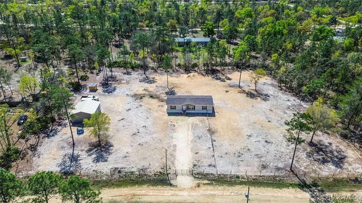 2.52 Acres of Residential Land with Home for Sale in Dunnellon, Florida