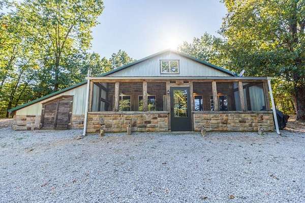 74.9 Acres of Recreational Land with Home for Sale in Windyville, Missouri