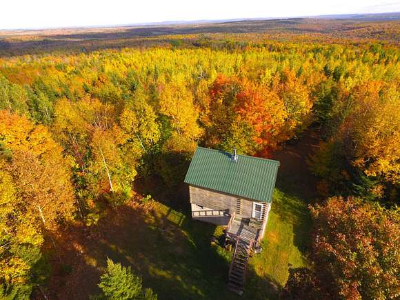 29.76 Acres of Recreational Land with Home for Sale in Ludlow, Maine