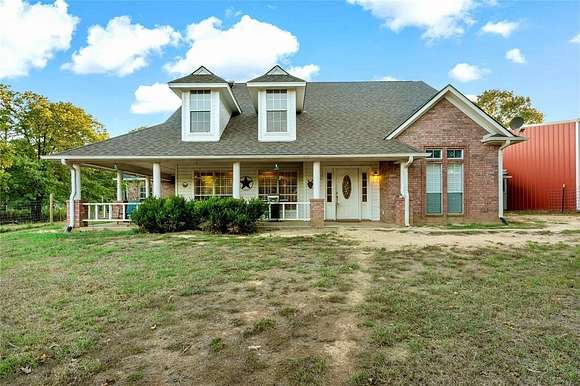 10 Acres of Residential Land with Home for Sale in Paris, Texas