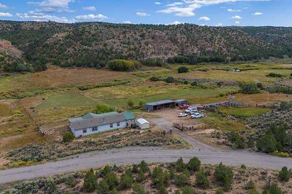 37 Acres of Agricultural Land with Home for Sale in La Madera, New Mexico