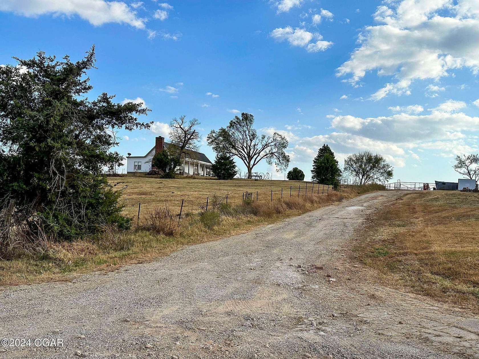 152 Acres of Agricultural Land with Home for Sale in Baxter Springs, Kansas