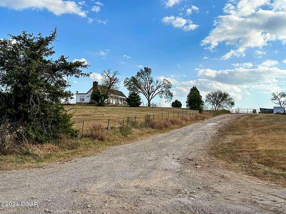 152 Acres of Agricultural Land with Home for Sale in Baxter Springs, Kansas