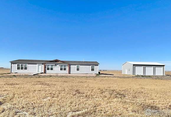 5 Acres of Residential Land with Home for Sale in Briggsdale, Colorado