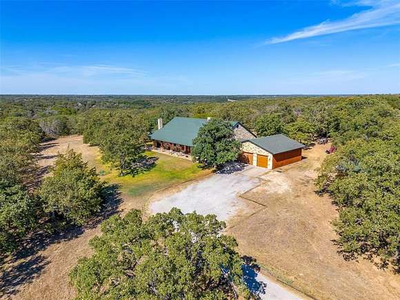 20.02 Acres of Agricultural Land with Home for Sale in Springtown, Texas