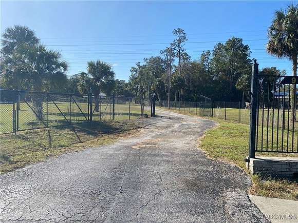 2.77 Acres of Residential Land with Home for Sale in Inglis, Florida