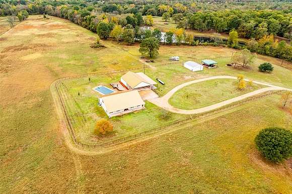 26.5 Acres of Agricultural Land with Home for Sale in Powderly, Texas