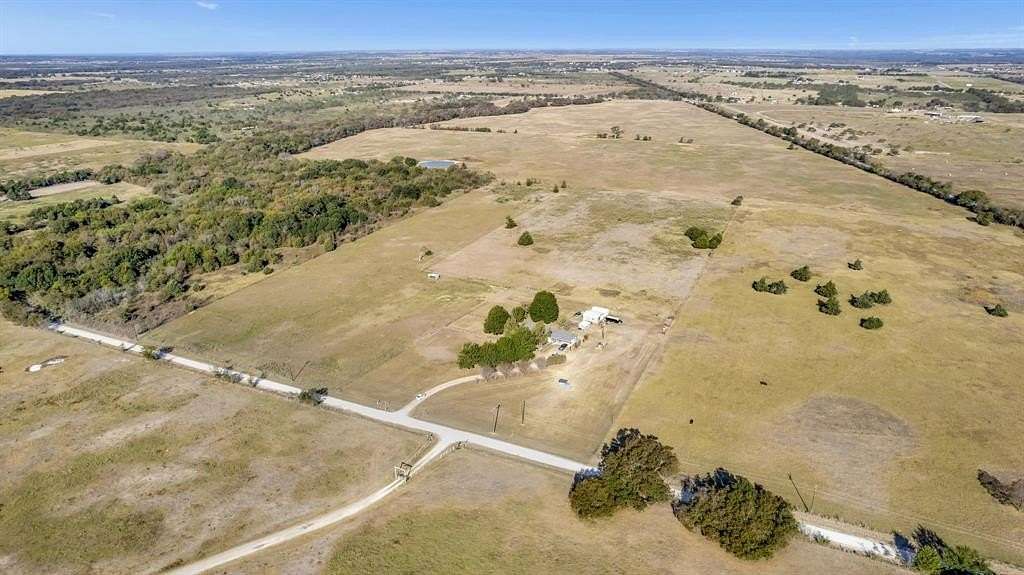 23.275 Acres of Agricultural Land with Home for Sale in Corsicana, Texas