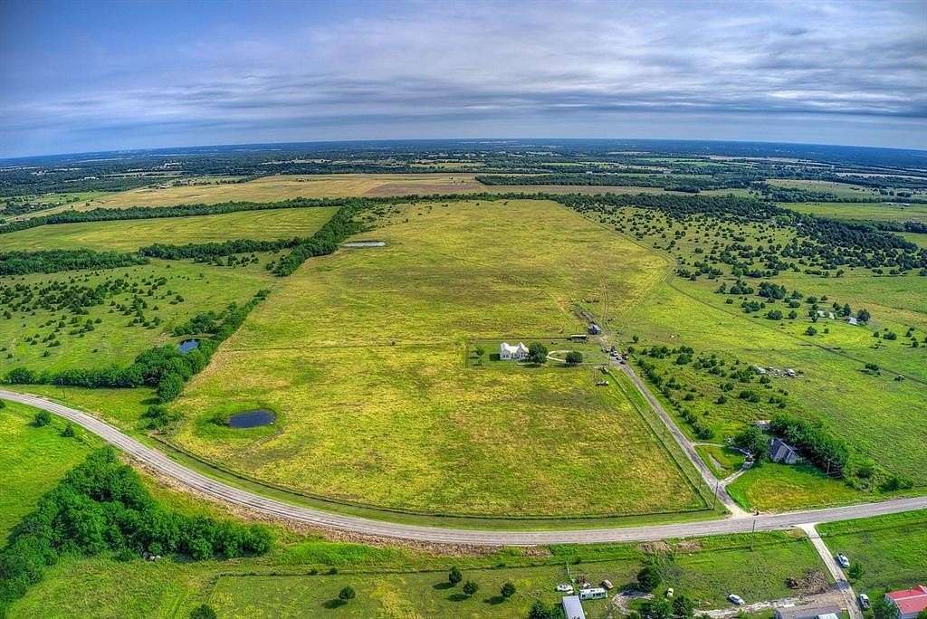 89.354 Acres of Land with Home for Sale in Wolfe City, Texas