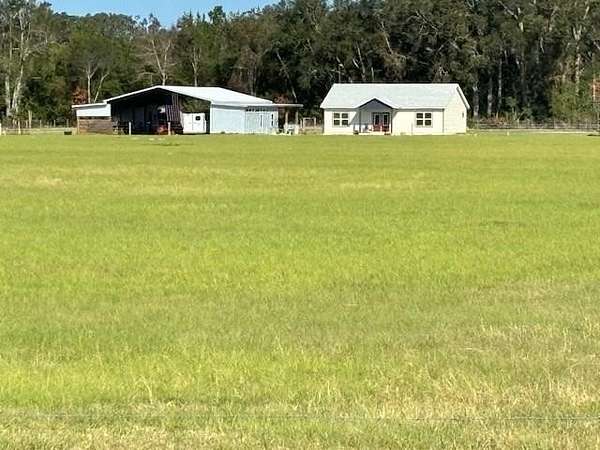 20.2 Acres of Agricultural Land with Home for Sale in Chiefland, Florida
