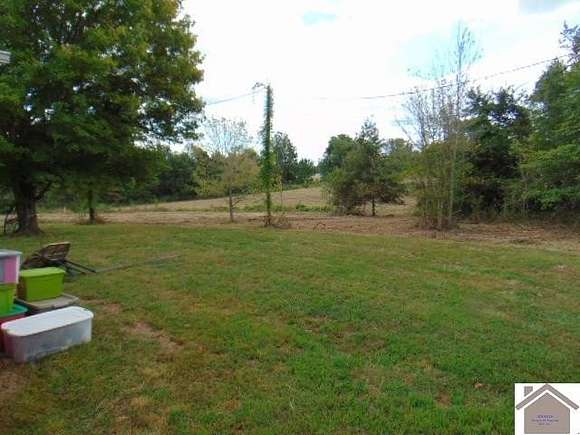 6.94 Acres of Residential Land with Home for Auction in Wingo, Kentucky