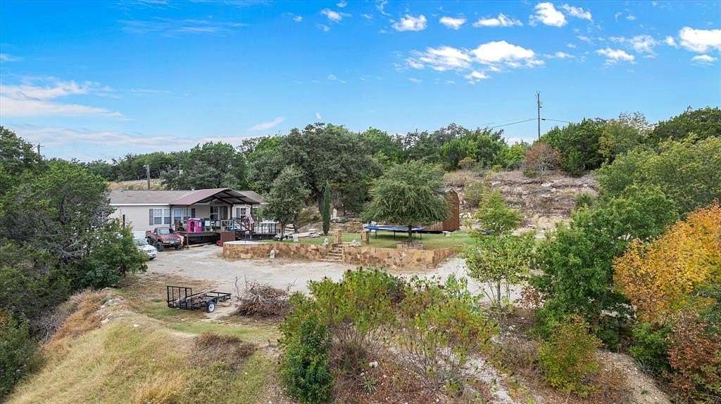 2.01 Acres of Residential Land with Home for Sale in Granbury, Texas