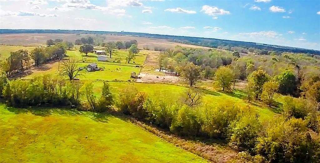 10 Acres of Residential Land with Home for Sale in Deport, Texas