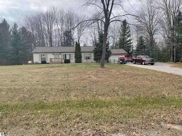 10 Acres of Residential Land with Home for Sale in Whittemore, Michigan