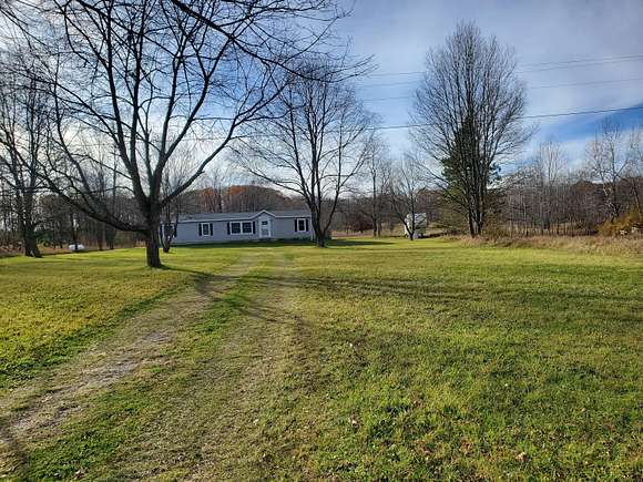 10 Acres of Residential Land with Home for Sale in Farwell, Michigan