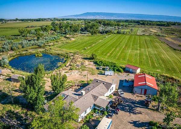 46.6 Acres of Agricultural Land with Home for Sale in Olathe, Colorado