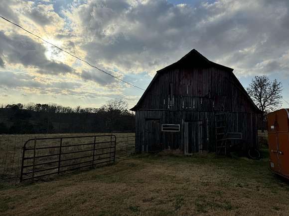 57 Acres of Land with Home for Sale in Niangua, Missouri