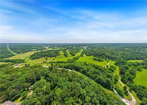 98 Acres of Land with Home for Sale in Camdenton, Missouri