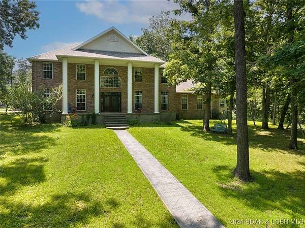 178 Acres of Land with Home for Sale in Camdenton, Missouri