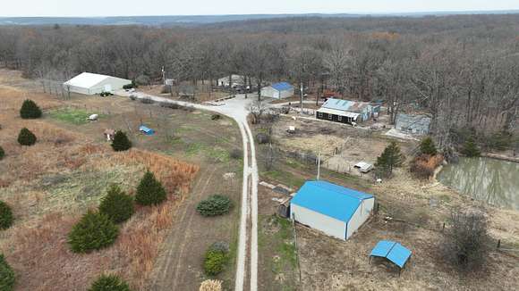 139.24 Acres of Recreational Land with Home for Sale in Long Lane, Missouri