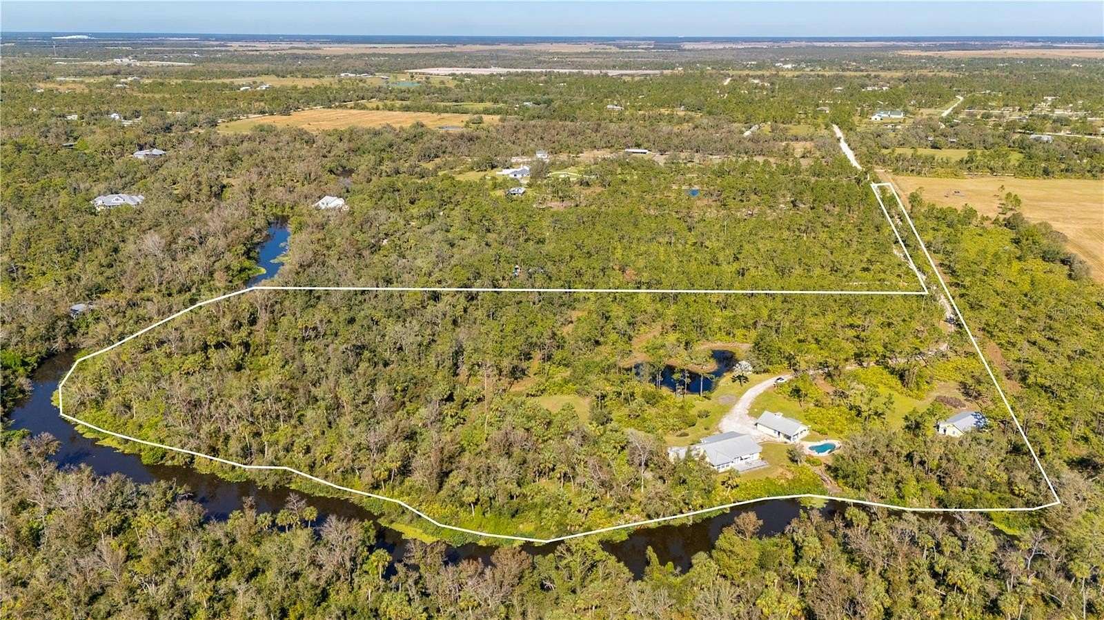 11.9 Acres of Land with Home for Sale in Punta Gorda, Florida