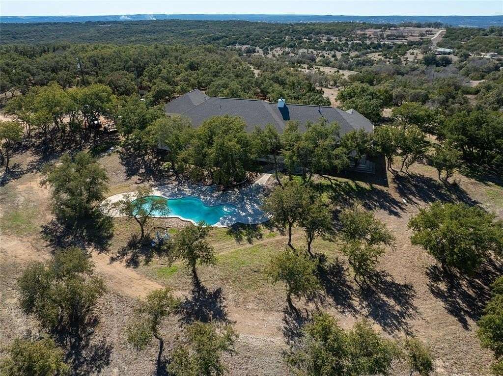 21.487 Acres of Agricultural Land with Home for Sale in Marble Falls, Texas