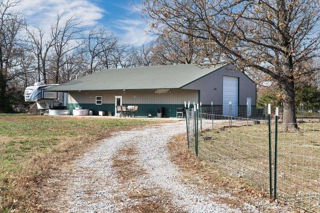 61.63 Acres of Recreational Land with Home for Sale in Gravette, Arkansas