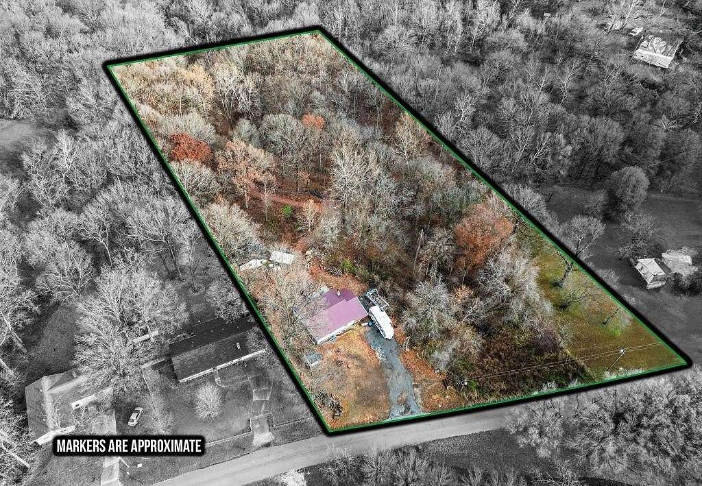 4.21 Acres of Residential Land with Home for Sale in Gravette, Arkansas