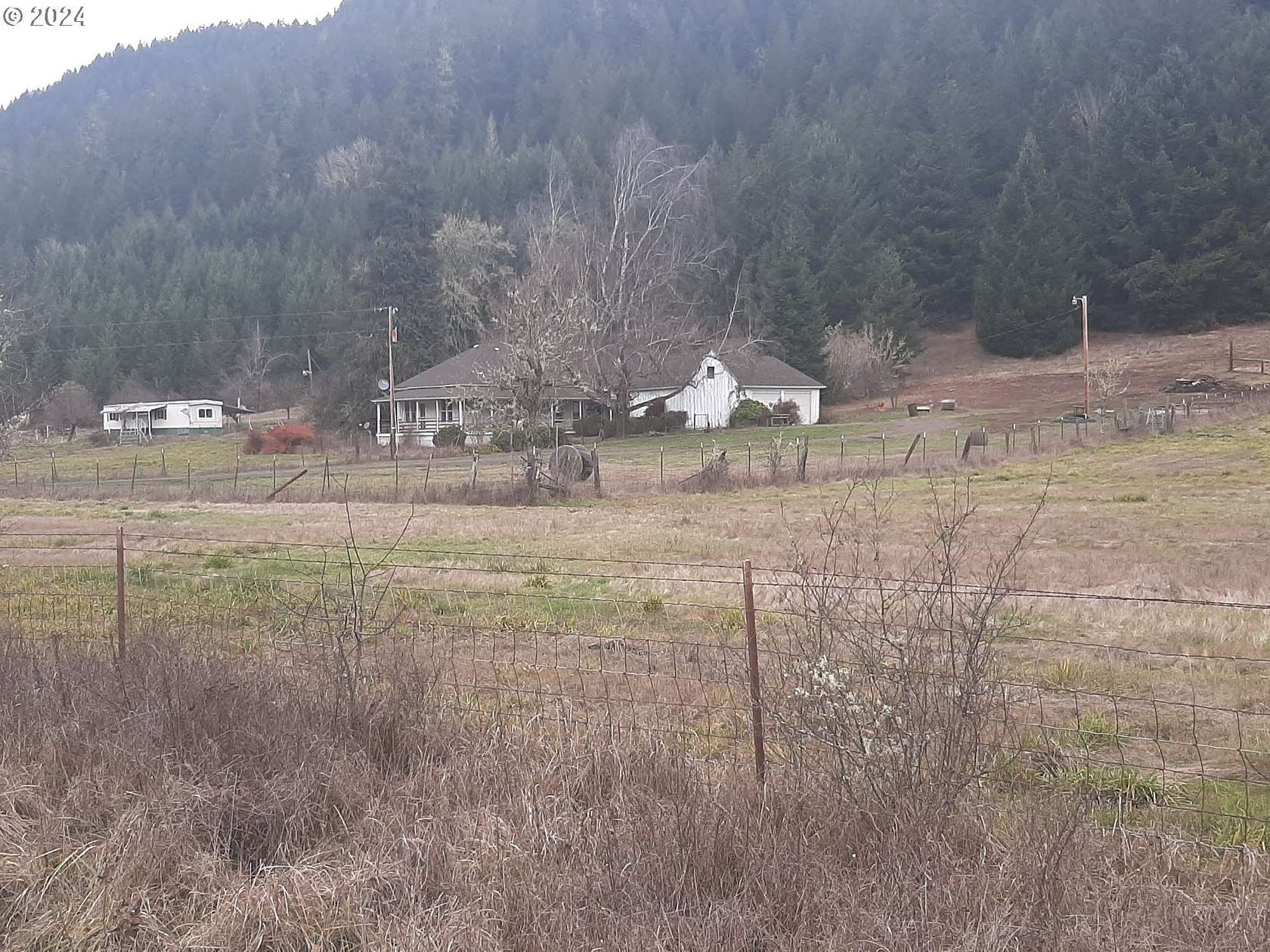 80.21 Acres of Agricultural Land with Home for Sale in Dorena, Oregon