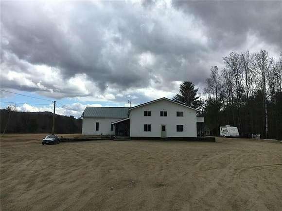 13.97 Acres of Land with Home for Sale in Rumford, Maine