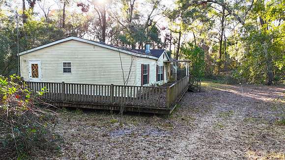 4.85 Acres of Residential Land with Home for Auction in Fort White, Florida