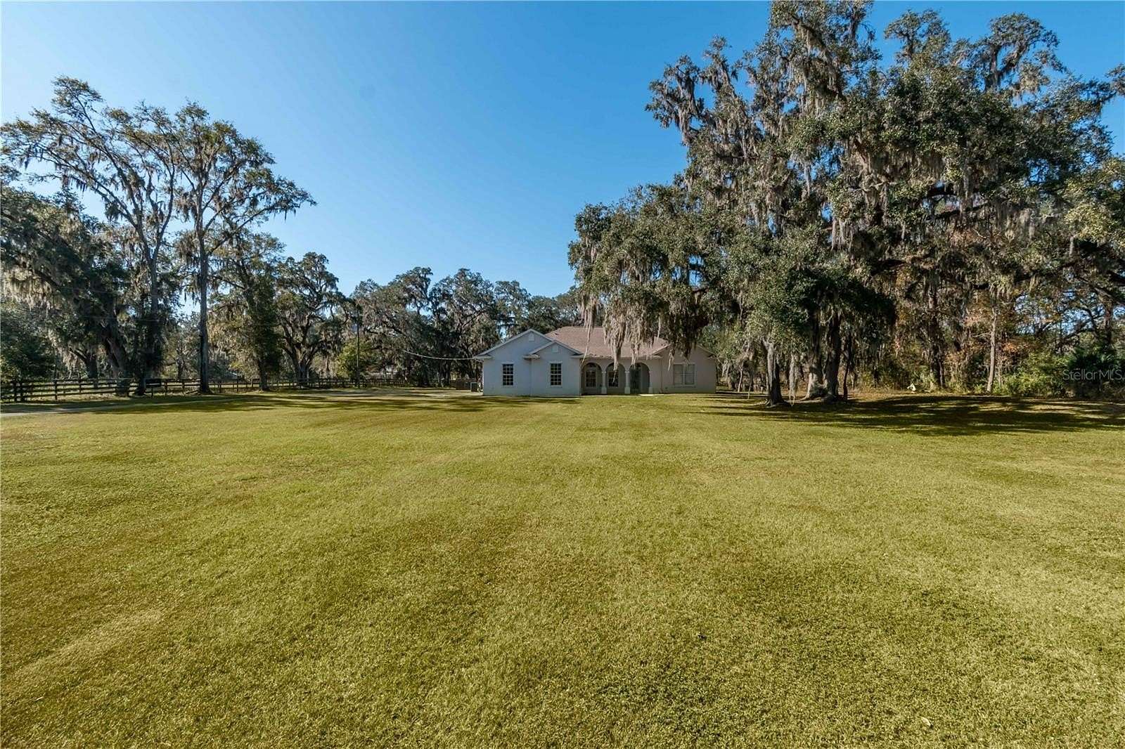 4.98 Acres of Residential Land with Home for Sale in Reddick, Florida