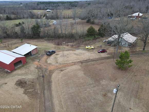 3.7 Acres of Residential Land with Home for Sale in Scotts Hill, Tennessee