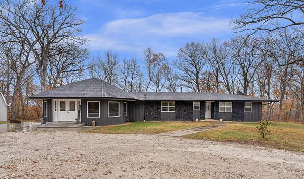 10.7 Acres of Land with Home for Sale in Bolivar, Missouri
