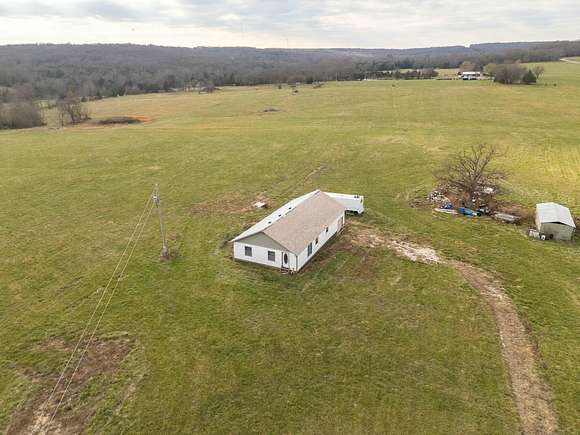 36.9 Acres of Improved Agricultural Land for Sale in Dunnegan, Missouri