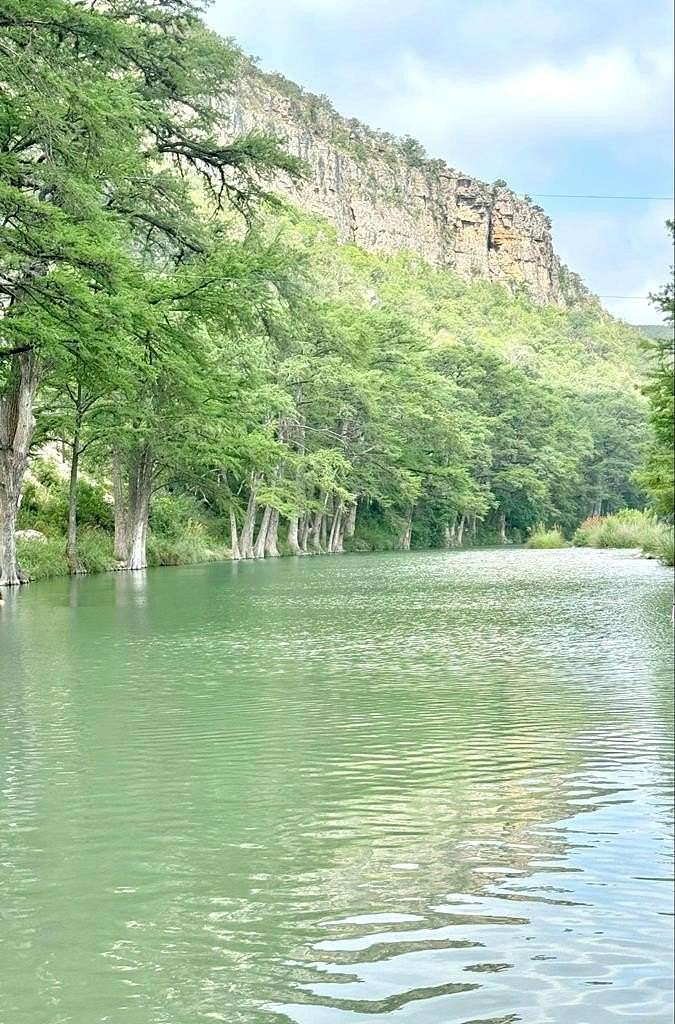 12.65 Acres of Recreational Land with Home for Sale in Concan, Texas