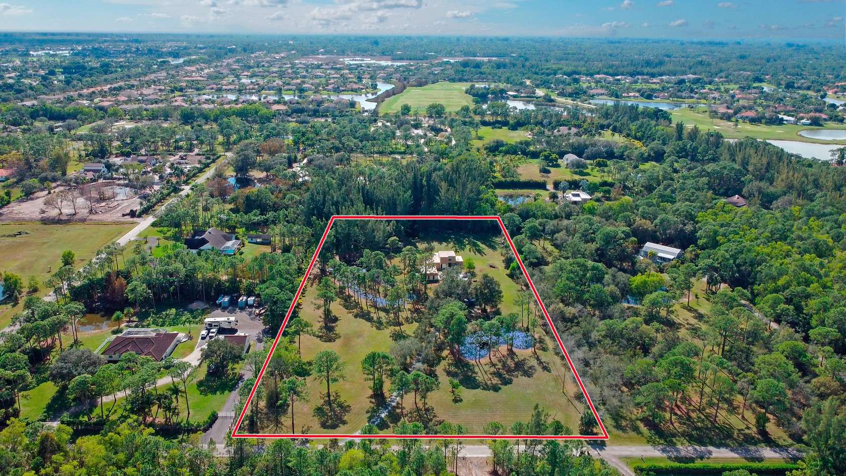 4.992 Acres of Residential Land with Home for Sale in Palm Beach Gardens, Florida