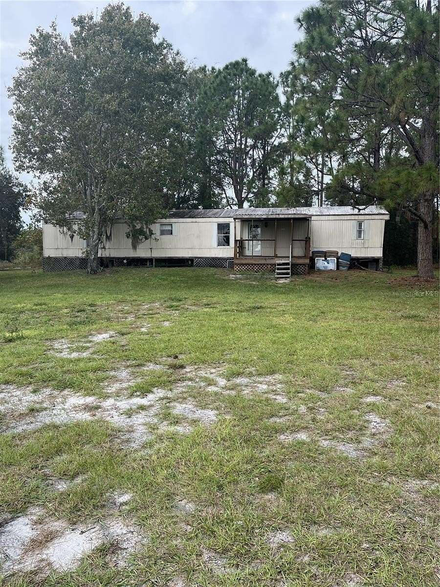 4.98 Acres of Residential Land with Home for Sale in St. Cloud, Florida