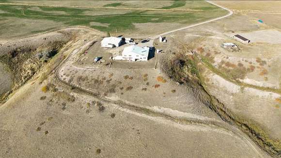 80 Acres of Agricultural Land with Home for Sale in Power, Montana